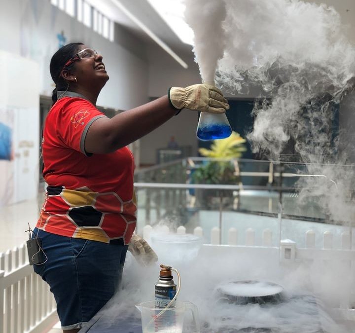 Scientist conducting a science show with a dry ice cloud | Street Science