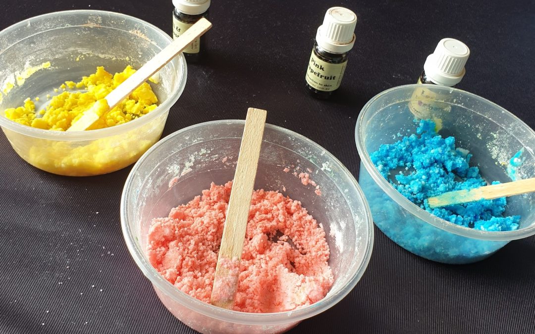 Three plastic containers with blue, pink and yellow powders | Street Science